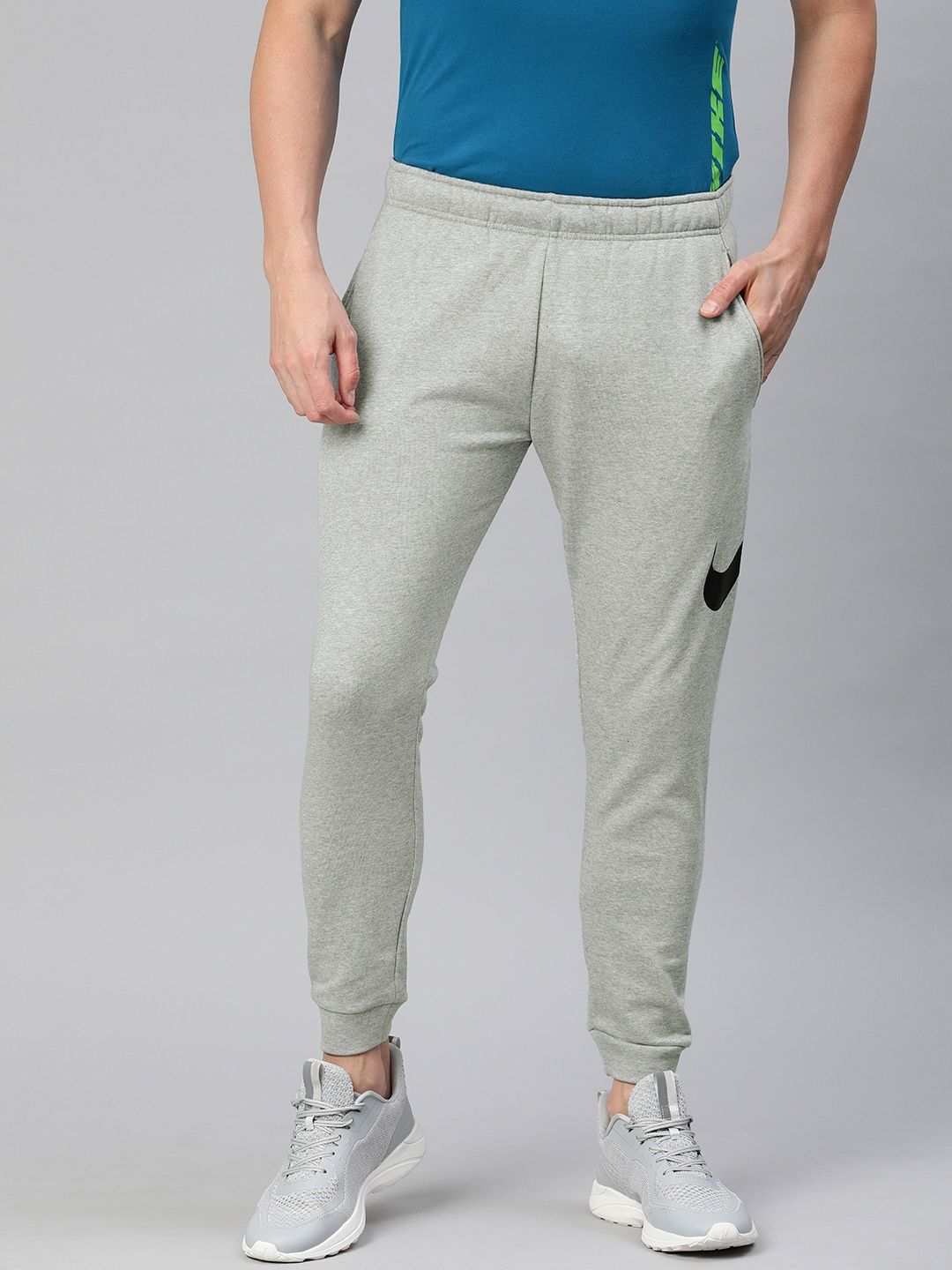  Nike Men Grey Solid Dri-FIT M NK Tapered Fit Training Joggers With Printed Detailing