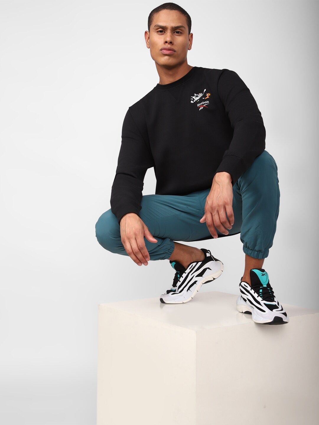 Reebok Men Tom And Jerry Printed Classic Pullover Sweatshirt