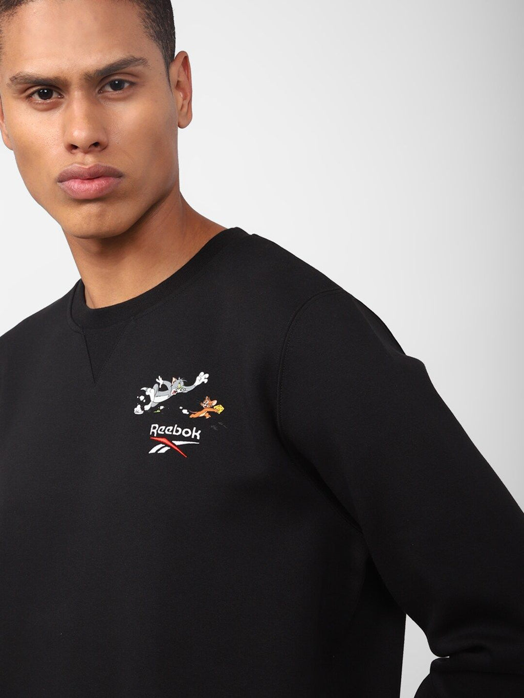  Reebok Men Tom And Jerry Printed Classic Pullover Sweatshirt