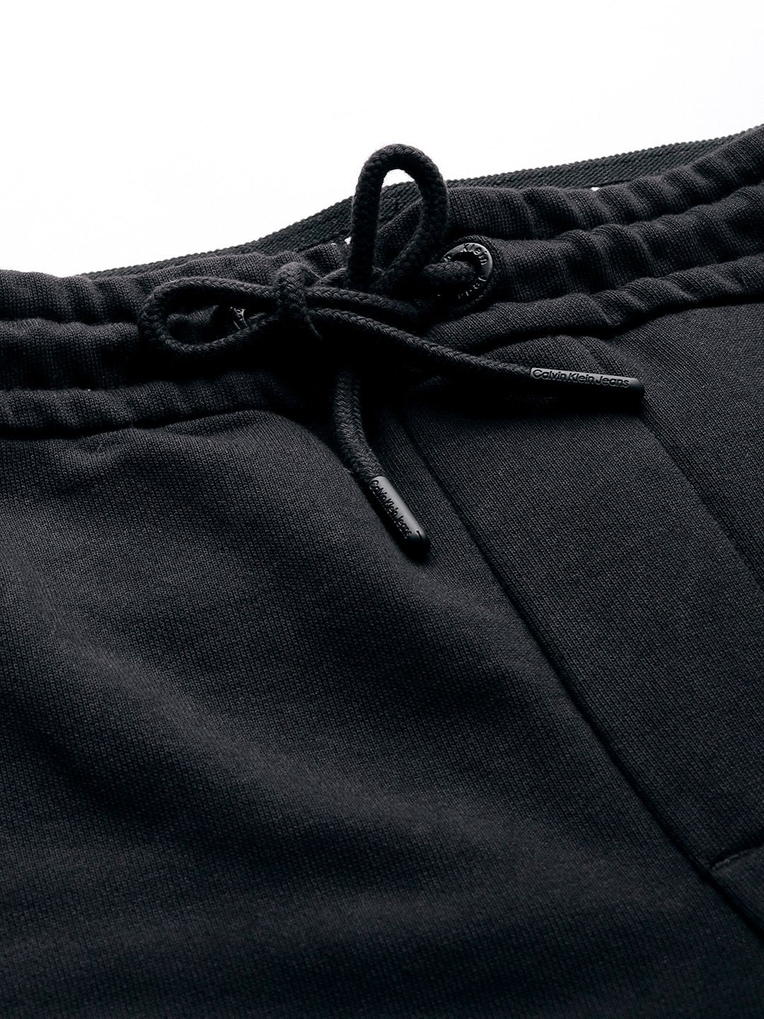  Calvin Klein Jeans Men Mid-Rise Pure Cotton Track Pants With Typography Embroidered Detail