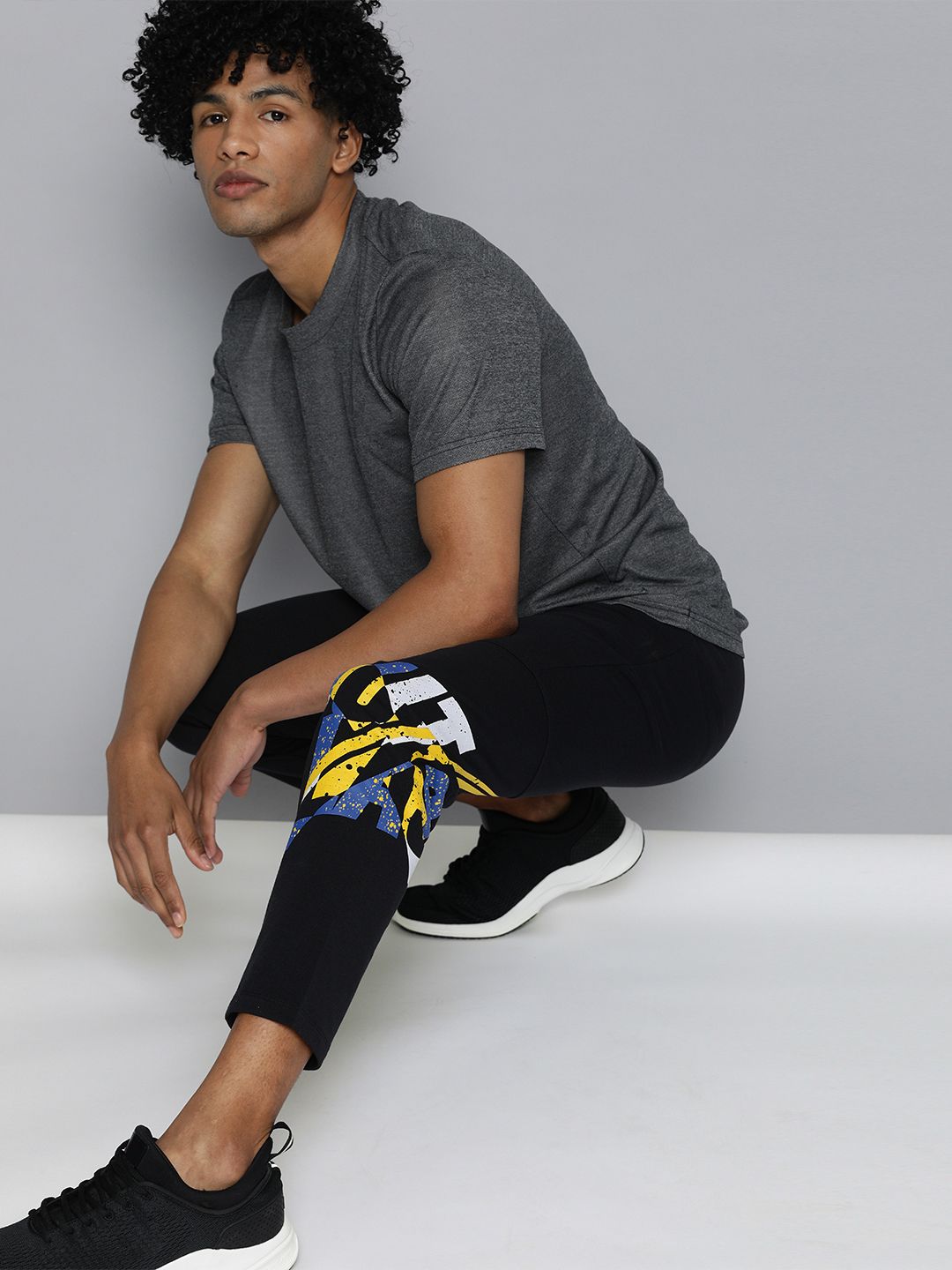  HRX By Hrithik Roshan Men Jet Black Solid Slim Fit Lycra Bio-Wash Gold Finish Lifestyle Track Pants
