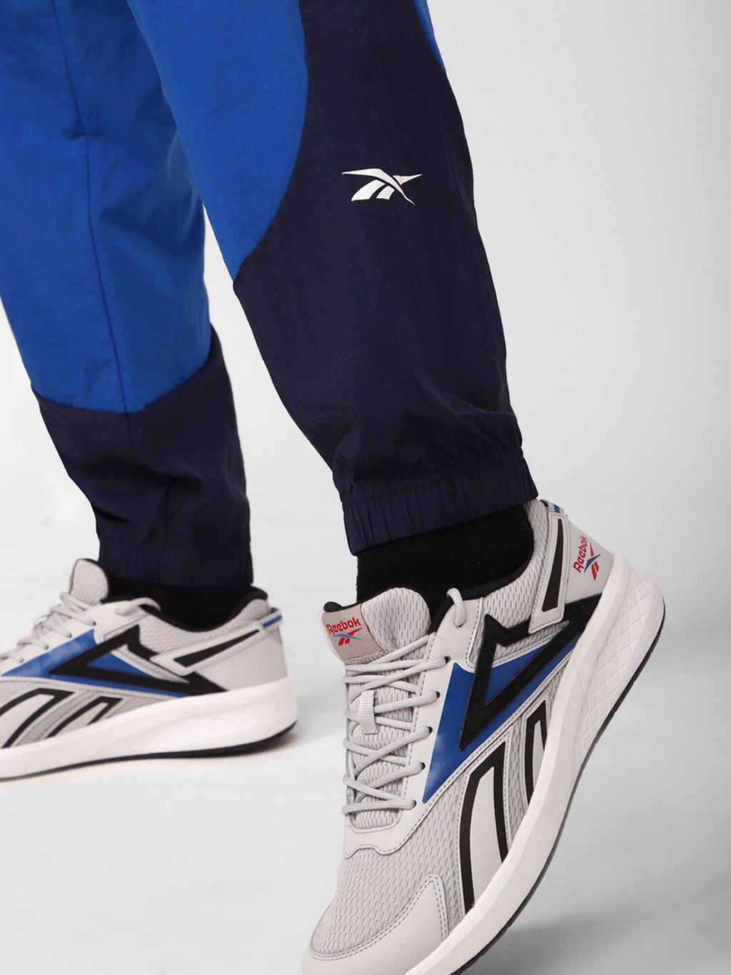  Reebok Men Train Woven Colourblocked Joggers
