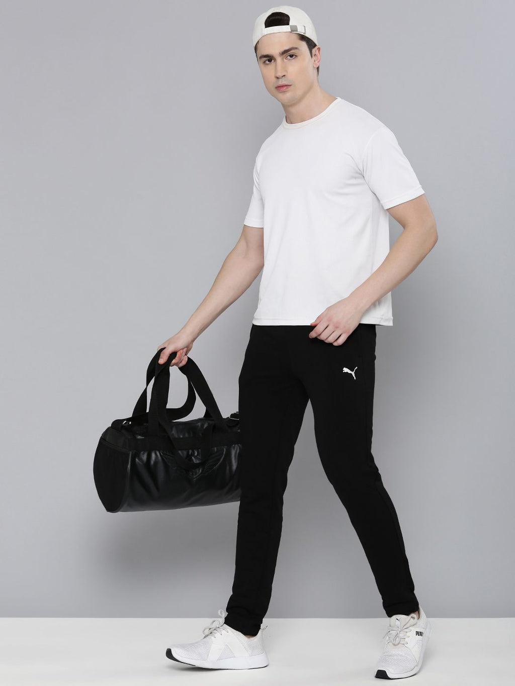  Puma Men Solid Slim Fit Zippered Knitted Track Pants