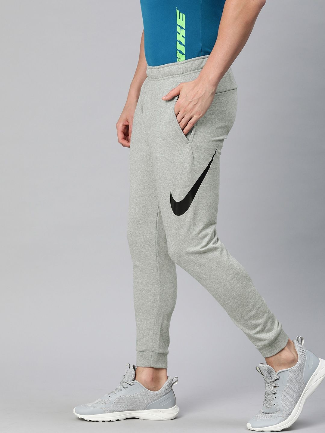  Nike Men Grey Solid Dri-FIT M NK Tapered Fit Training Joggers With Printed Detailing