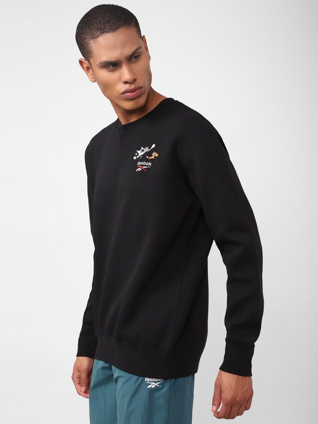  Reebok Men Tom And Jerry Printed Classic Pullover Sweatshirt