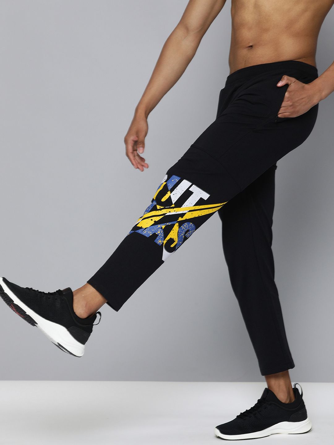  HRX By Hrithik Roshan Men Jet Black Solid Slim Fit Lycra Bio-Wash Gold Finish Lifestyle Track Pants