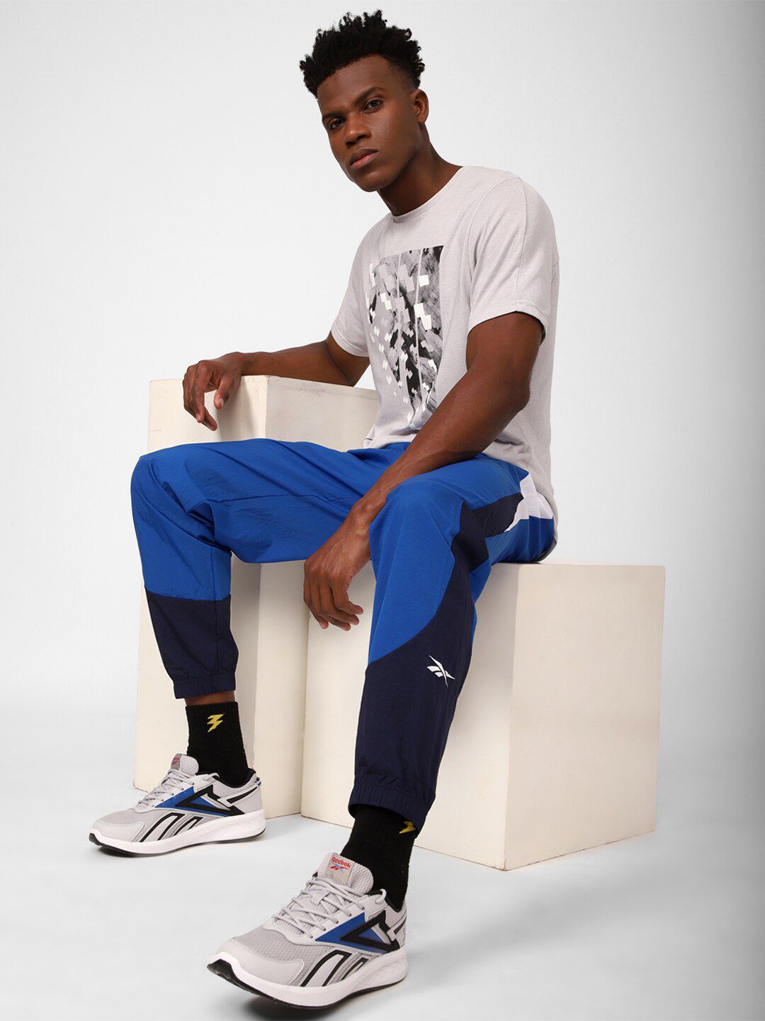  Reebok Men Train Woven Colourblocked Joggers